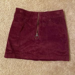 Burgundy skirt.